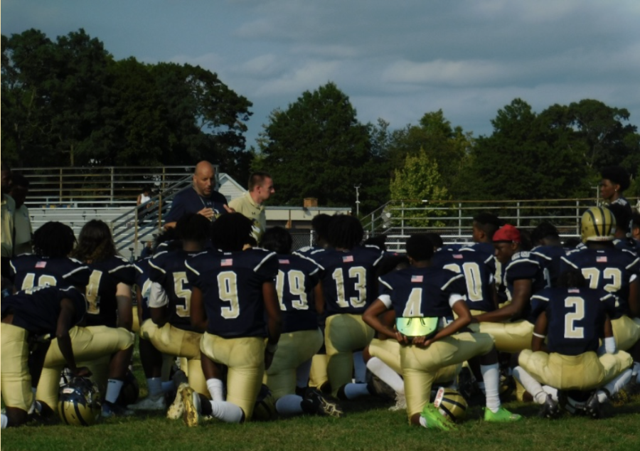 Coach Chimenti talking to varsity players after their 24-0 win over Uniondale