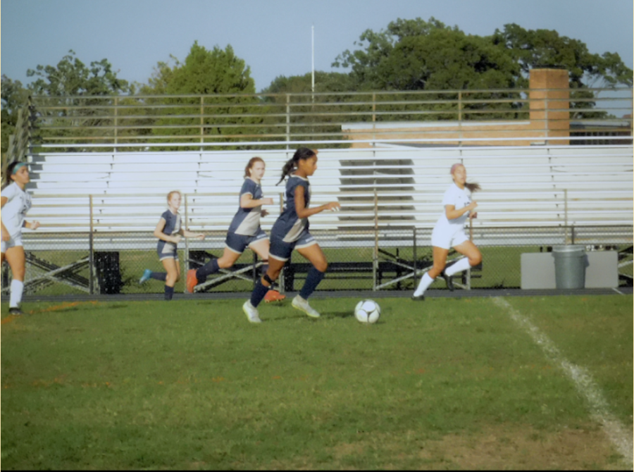 Sophomore, Annabelle Lopez advance the ball up the field for the Lady Bruins Soccer Team
final score ( 1-1)