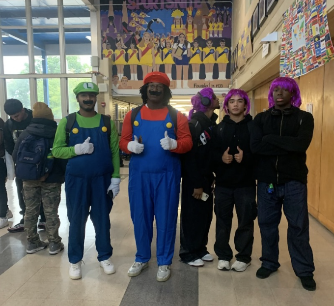Mario (Jalen George) and Luigi (Samson Mathew) meet the purple wig brothers ( Kenneth Bobb, Christopher Stegmuller, and Timothy Chiverton