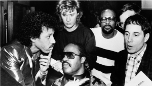 Left to right: Artists Lionel Richie, Stevie Wonder, Daryl Hall, Quincy Jones and Paul Simon.